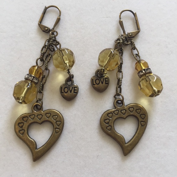Antiqued brass and gold-colored crystal ea…